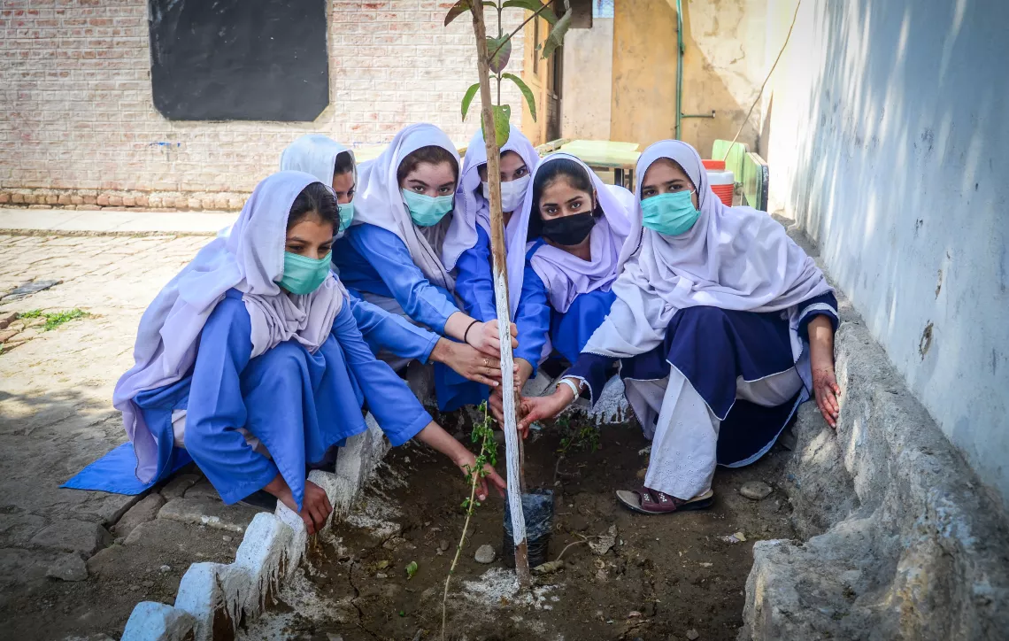 Malaika and her school mates plant a sapling in their ALP as part of adapting social behaviours for their healthy mental and physical growth as well as environmental improvement. 