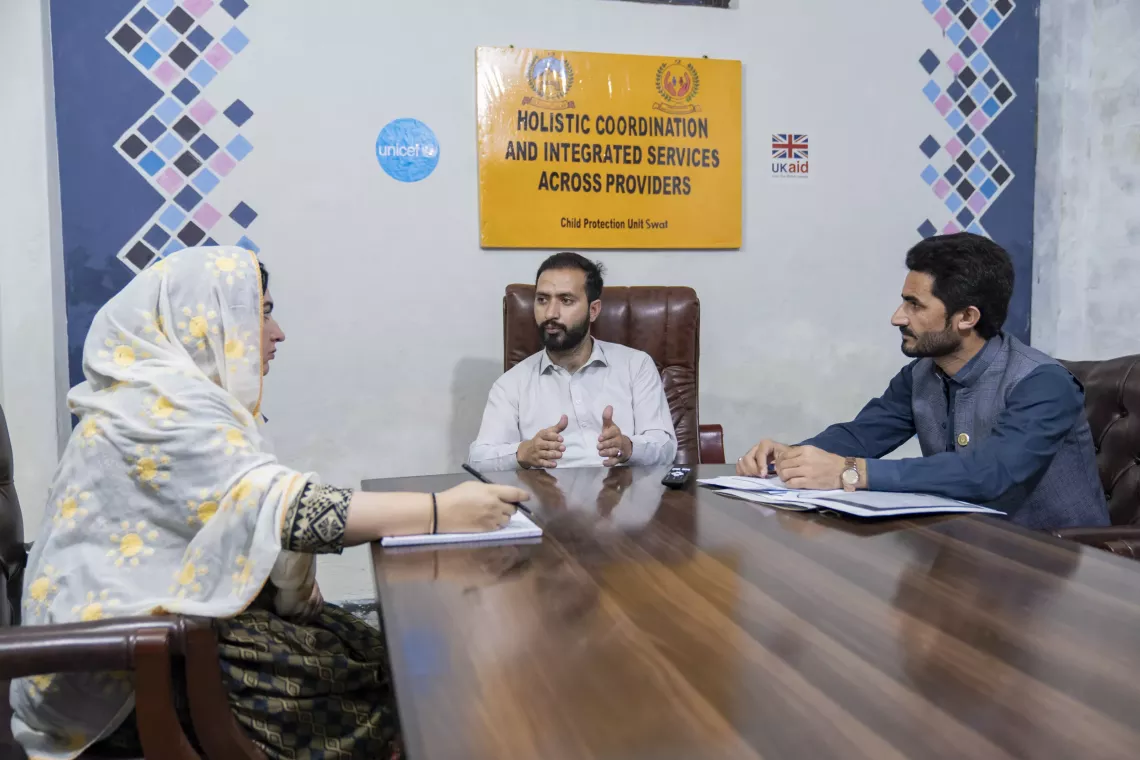   Psychologist &ndash; Maria Sultan (Left), Child Protection Officer &ndash; Ihsanullah (Centre) and Social Case Worker &ndash; Kefayatullah (Right) have a discussion during a meeting at the Child Protection Unit, Mingora, Swat District, Khyber Pakhtunkhwa. 