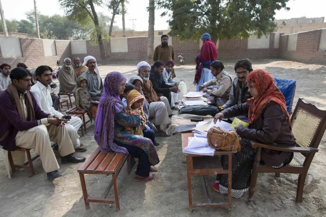 Parents and community members attend a birth registration camp