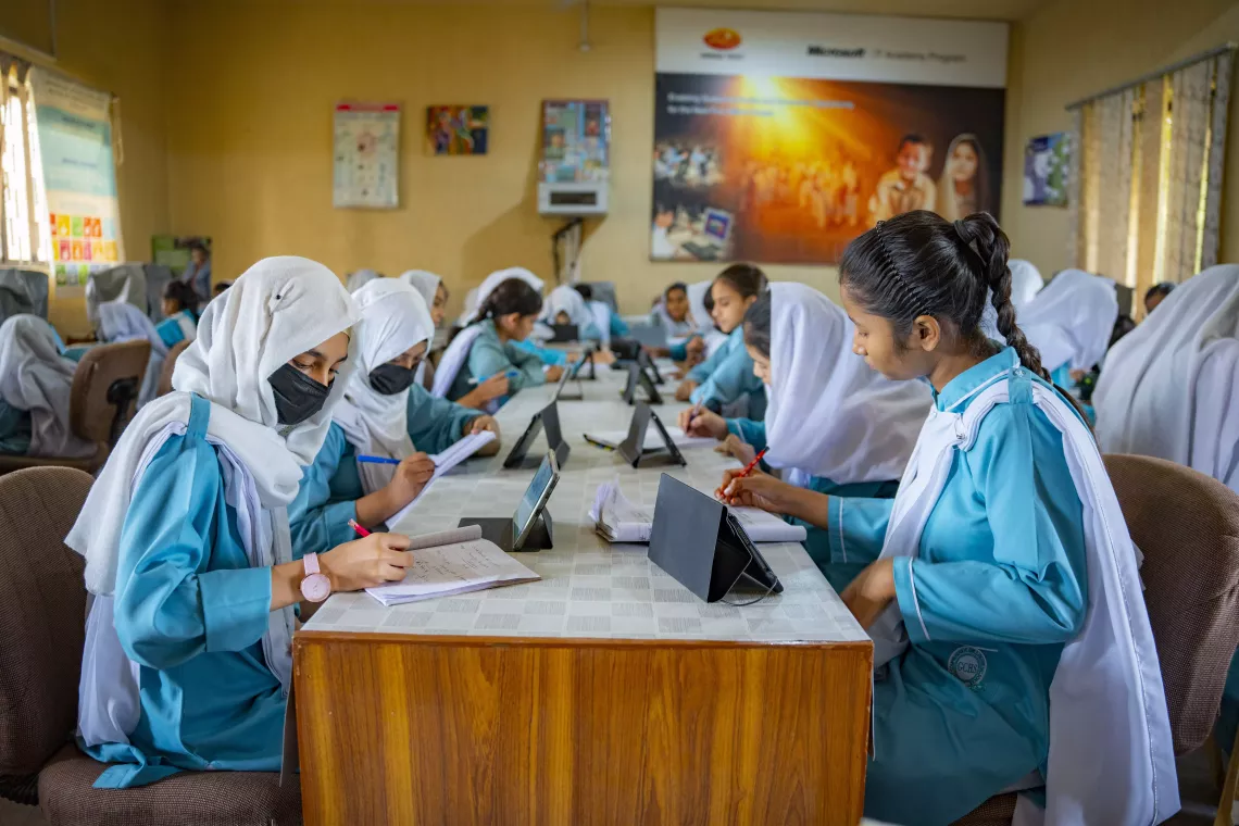 Students at the Government Girls High School in North Nazimabad take the assessment following a lesson on polynomials.