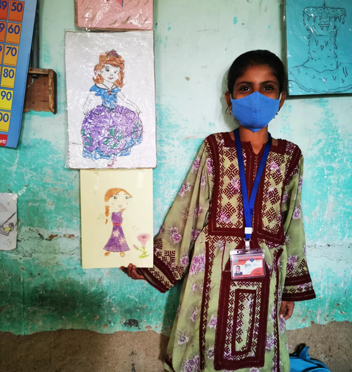 Starry-eyed student Durnaaz proudly showing one of her drawings.
