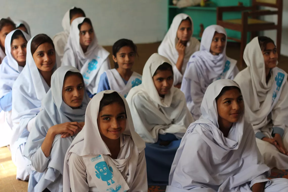 Girl students sitting during an MHM awareness session at their school