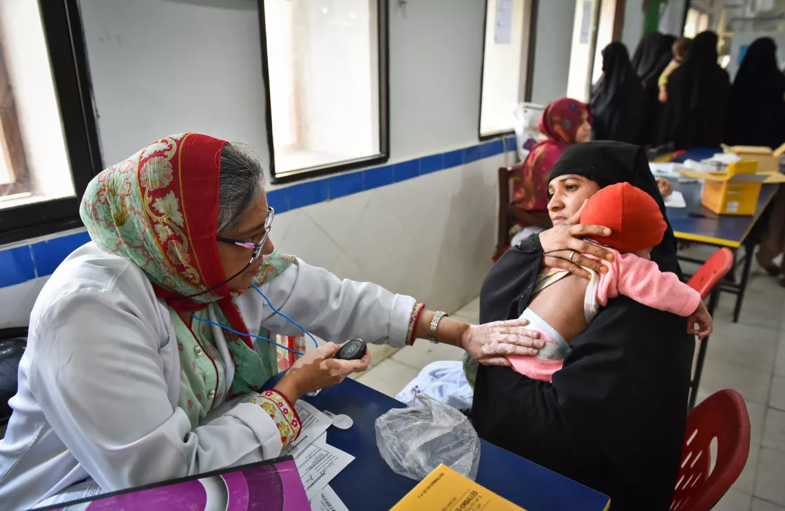 Dr. Armeena Khalid examining a child at the hospital