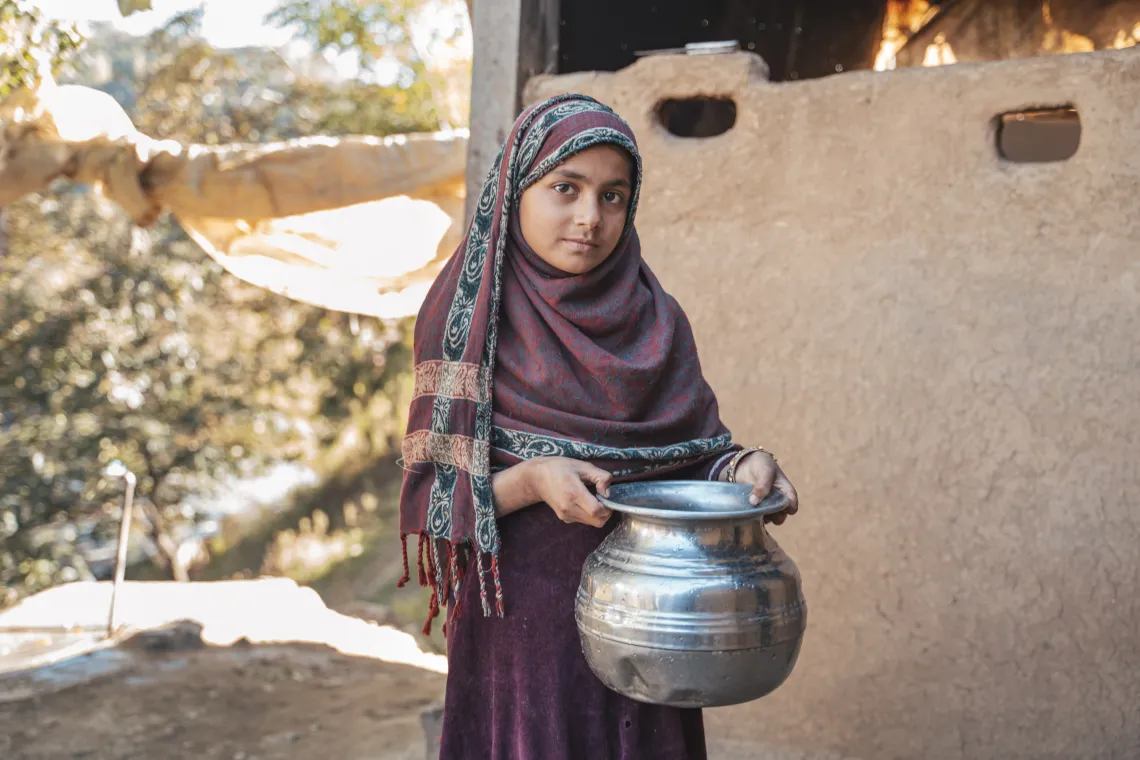  Raishma (8) is happy to get water at home through a supply line.