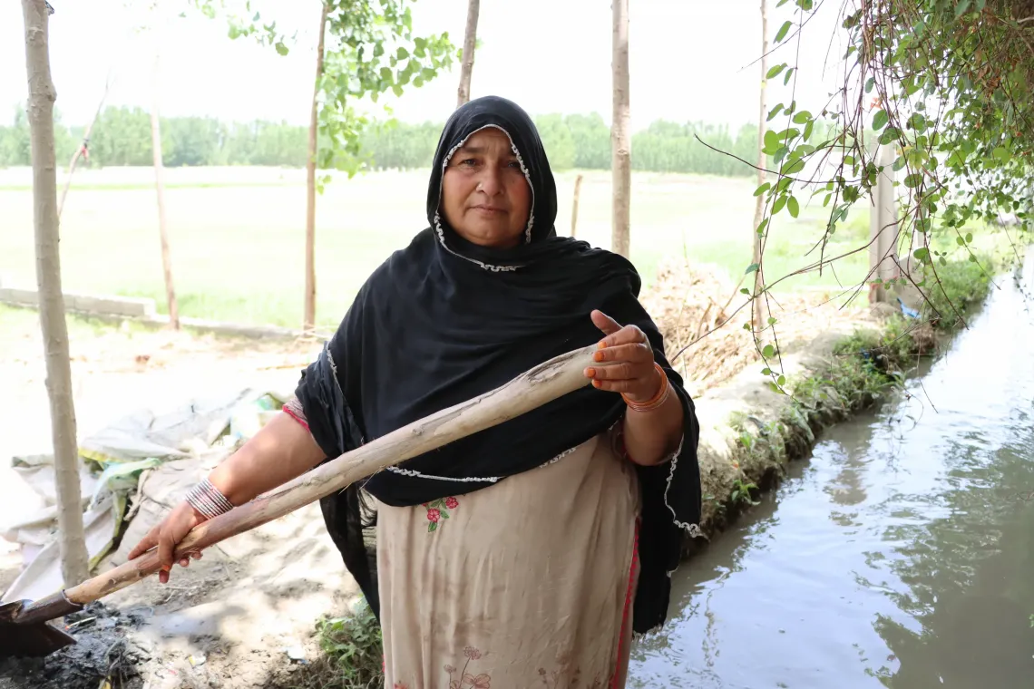 Zahida Bibi, an active member of the Community-Based Child Protection Committee in Khazana Dheri, manages her household while also working to protect and promote child rights in her community.