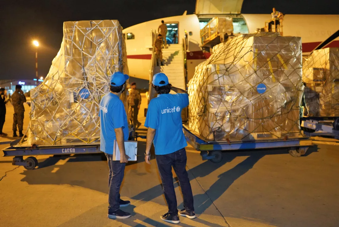 On 4 September 2022, UNICEF staff oversee the unloading of humanitarian supplies for flood-affected people in Pakistan from a charter flight at Karachi Airport.
