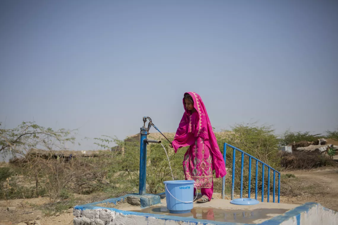 Farzana walks just five minutes to the new hand pump in her village to collect clean, safe water for her family. 