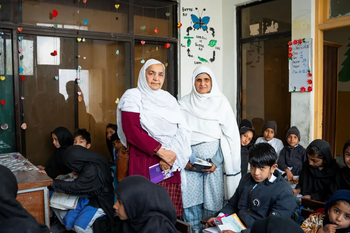 Mariam Bibi and Mrs Nazat monitor classroom activity Zoe Bibi Primary School in Mathra, Khyber Pakhtunkhwa