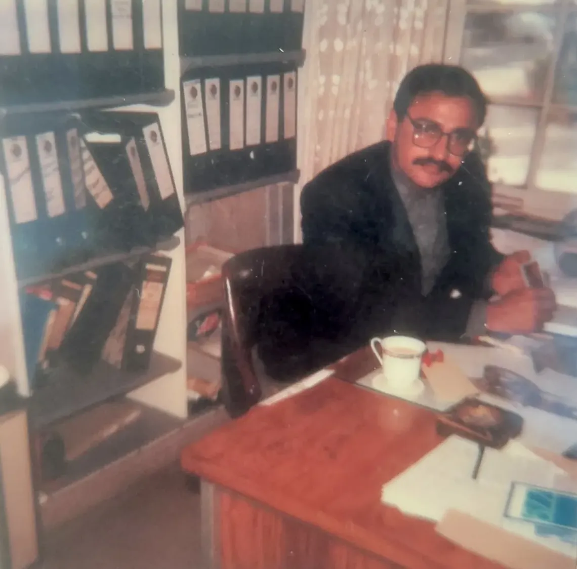 Ijaz sitting inside his office
