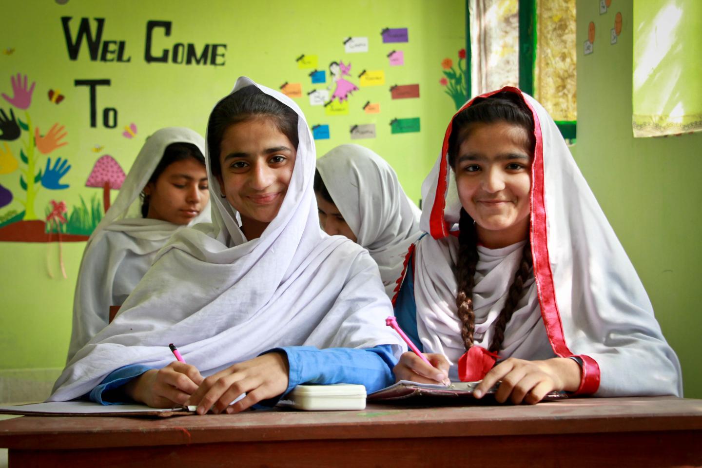 Students writing in classroom