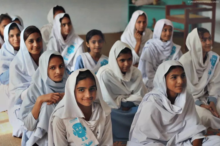 Schoolgirls in their classroom during a training session by their teacher on menstrual hygiene myths and best practices