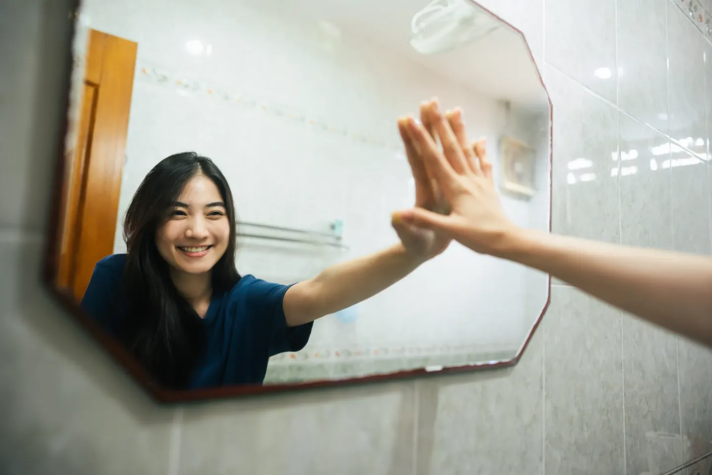 Body image: Teen girl looking in mirror