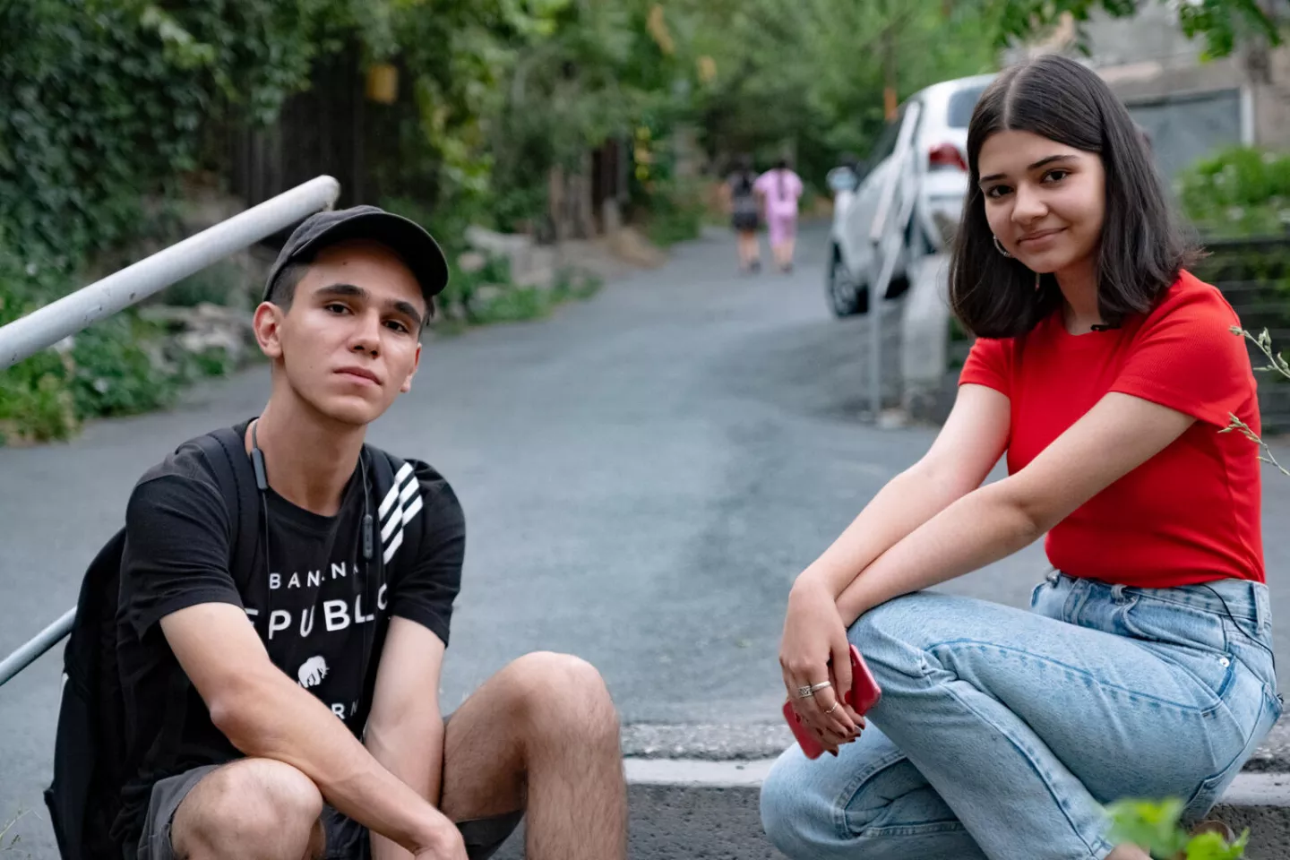 Teens and risky behaviour - two teenagers look at the camera
