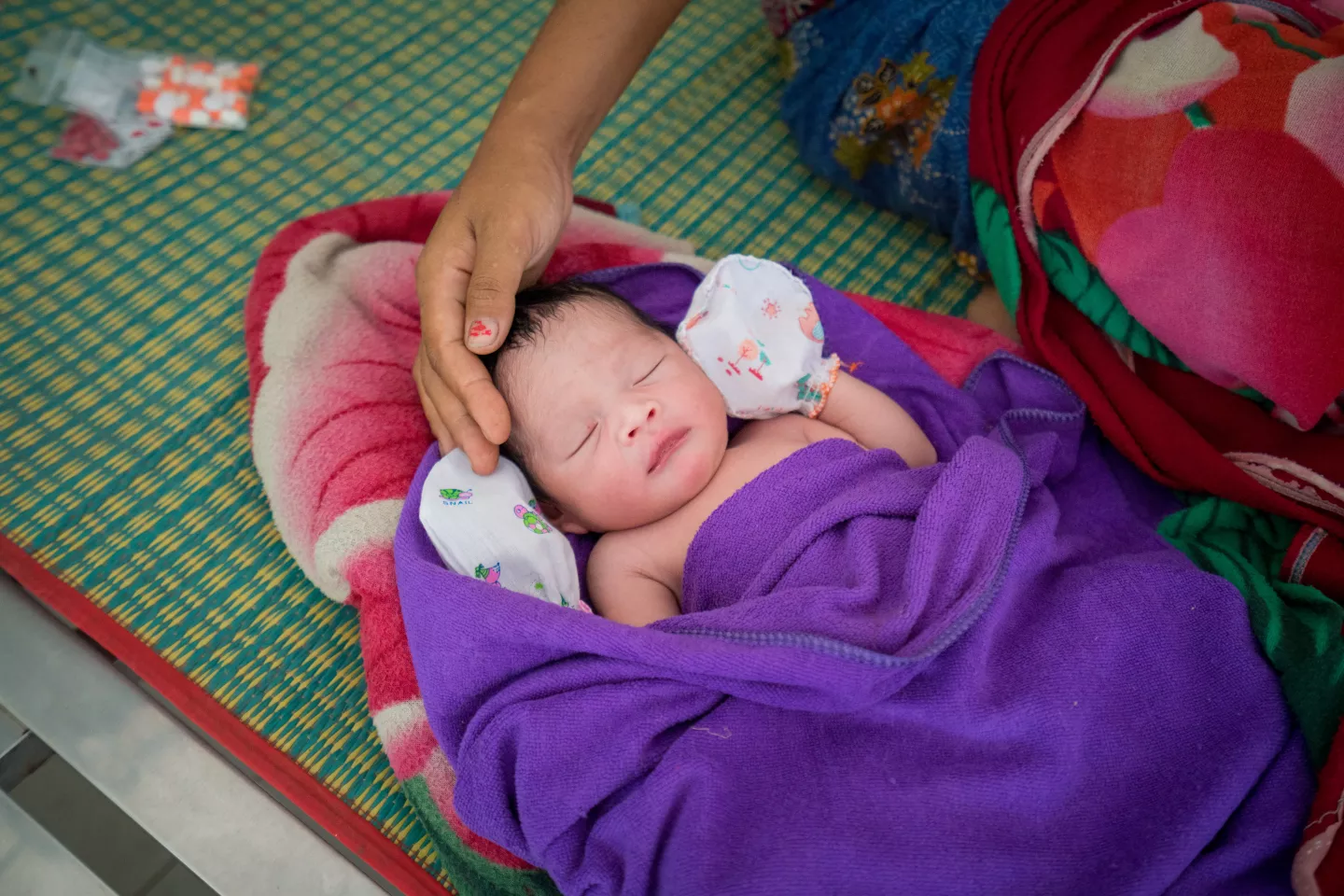 A new born and his mother at Sambo Health centre.