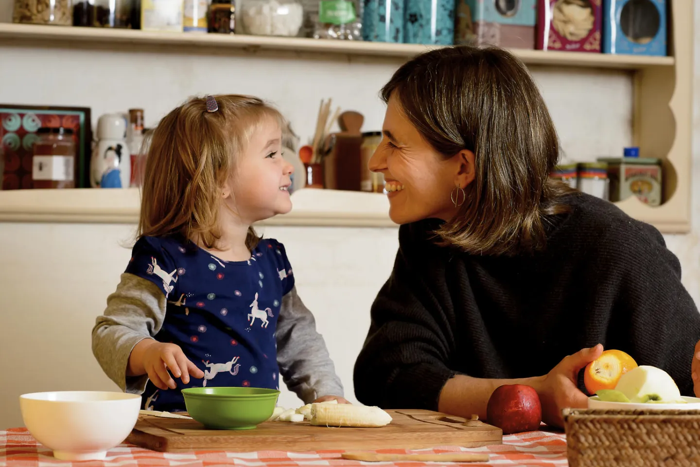 On 10 July, 2019, Matilde, 2, prepares fruit salad with her mother, Carolina, in the kitchen of their home in Montevideo, Uruguay. They enjoy spending time together preparing healthy foods to eat.