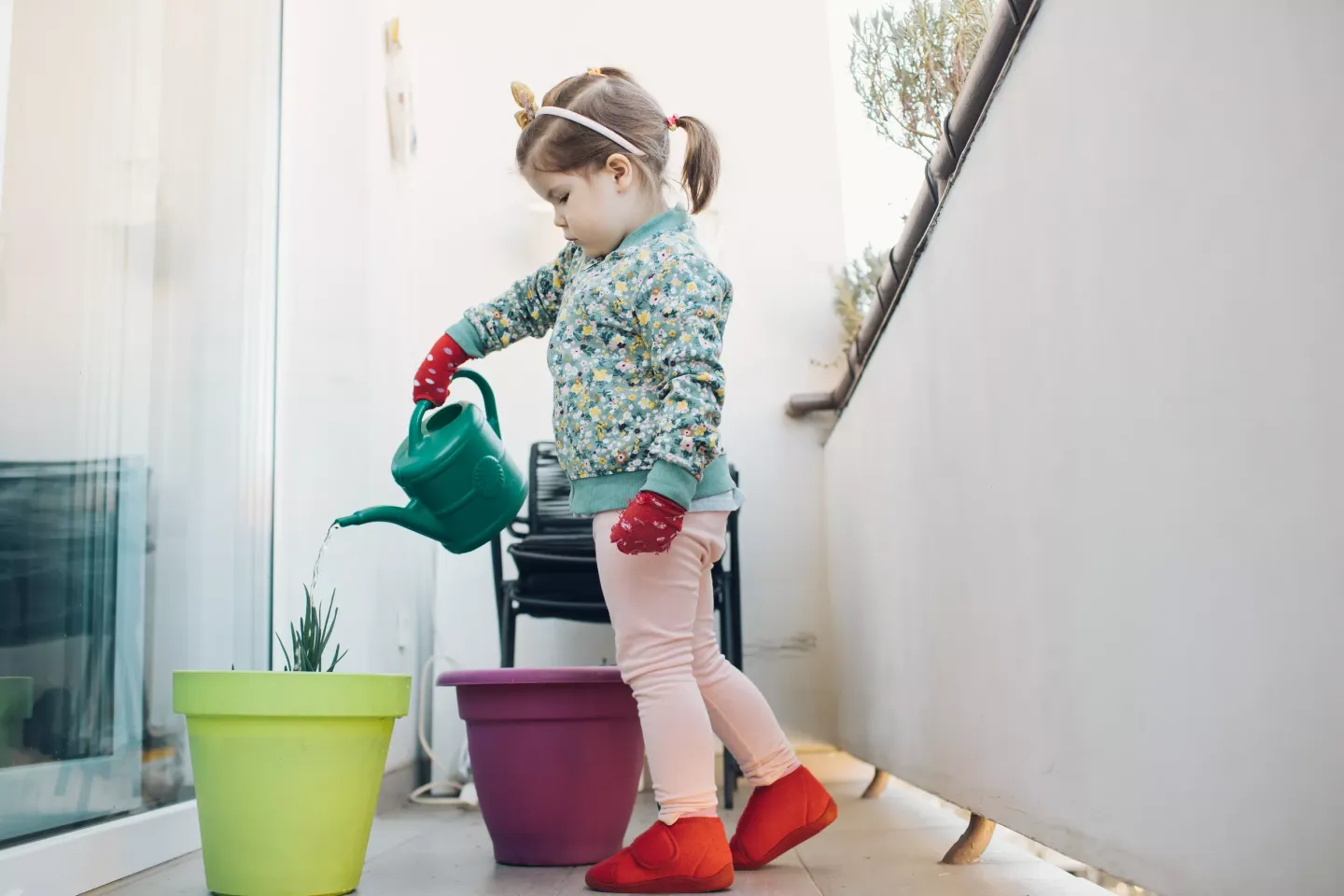 Little girl Nera introduced watering plants and flowers as one of her daily routines. It's just one of Nera's ways of coping with isolation to make her time pass as fast and as useful as possible.