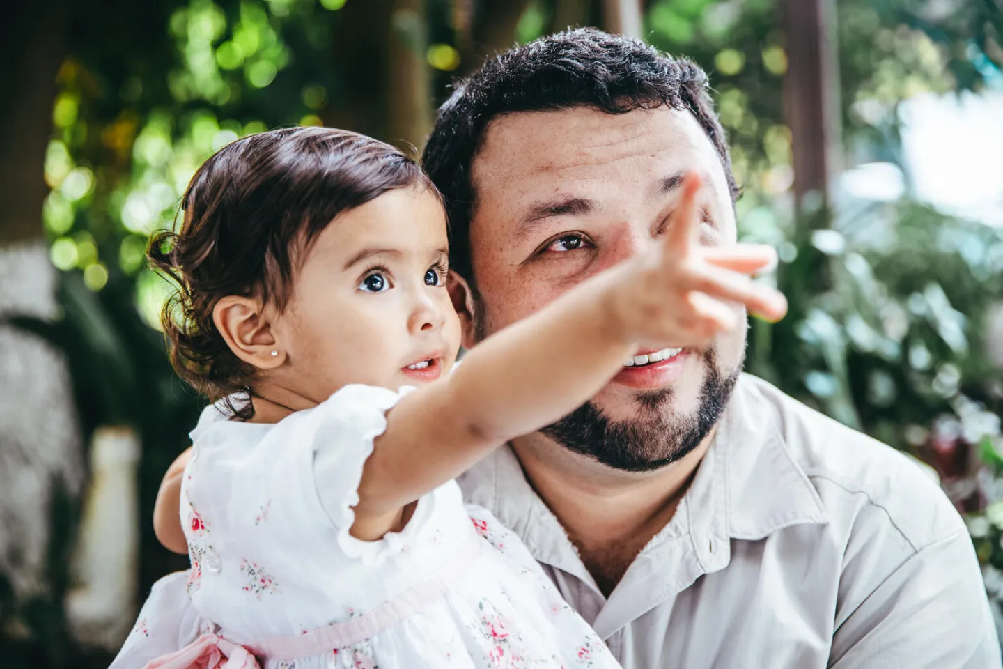  Ana Sofia Pi&ntilde;eda Lemus shows a bird on a tree to her father, Pablo Pi&ntilde;eda in Guatemala city.