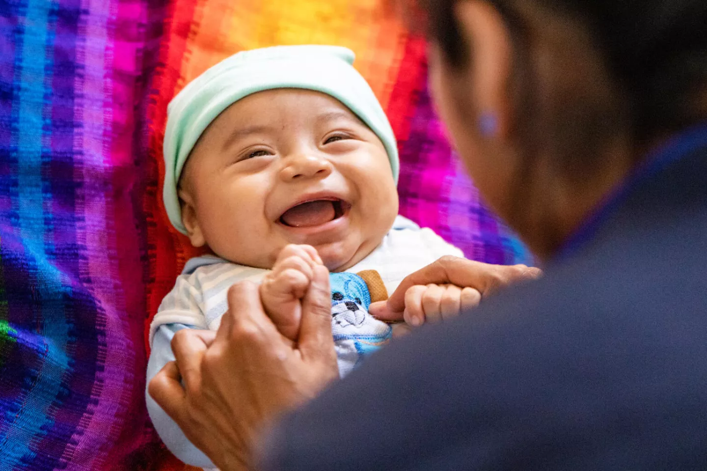 A mother of Chacalte Chichen (a mayan community where either Q'eqchi and /or Poqomchi is spoken), participates with her baby in a workshop about positive parenting and early child Development organized by the Comprehensive Child Development Community Centers (CECODII) a UNICEF supported center in Chirrepec, Alta Verapaz, Guatemala.