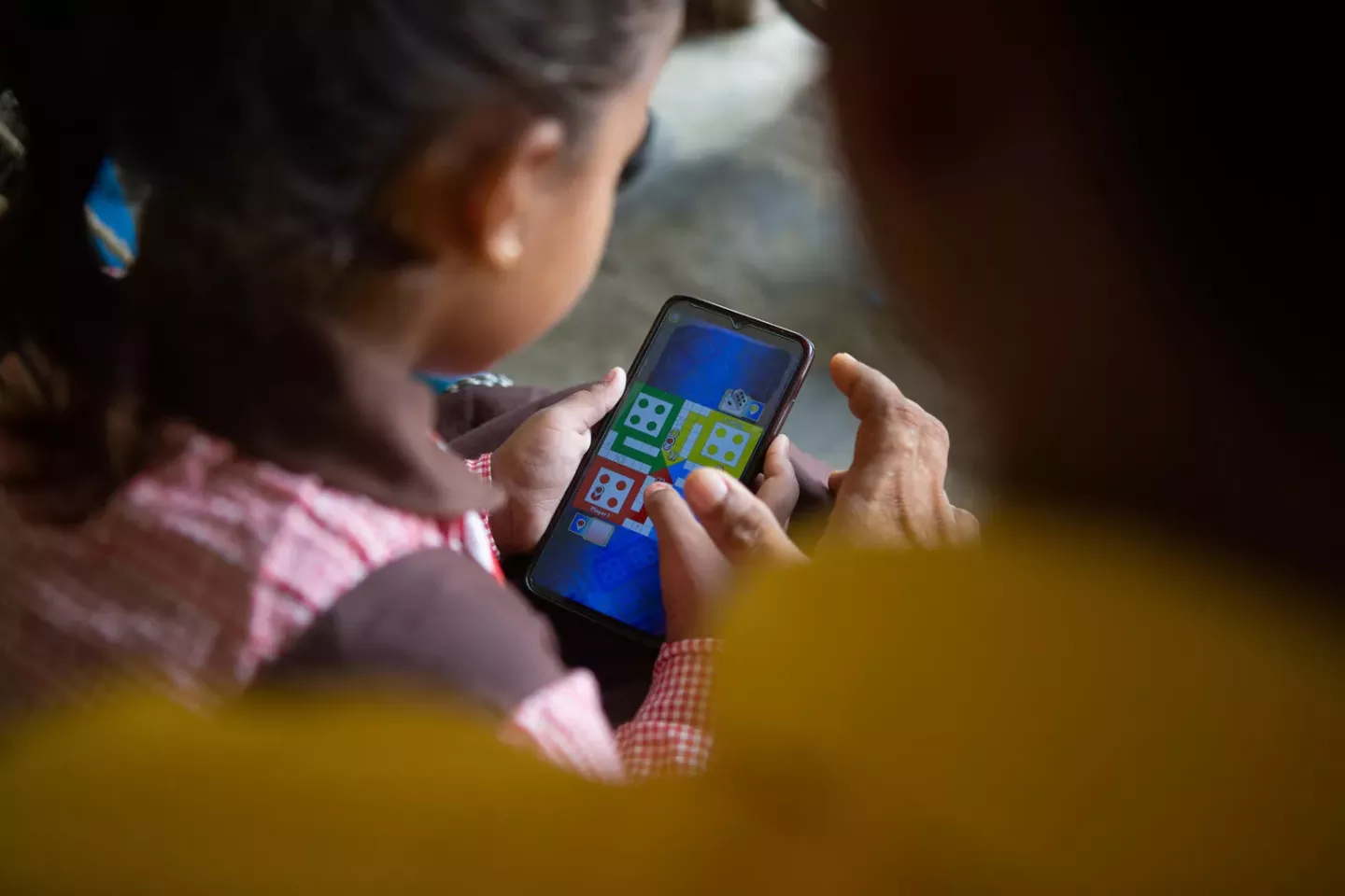 Online privacy - a girl uses a mobile phone
