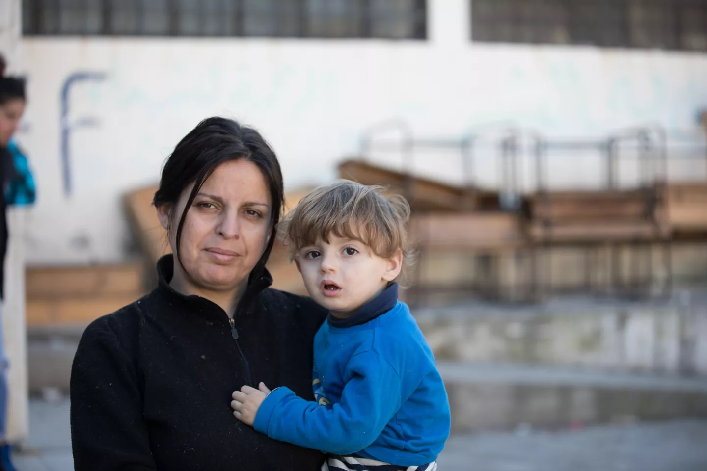 Dalia, 35, holds her two-year-old son in a school that is being used as a shelter in Stamo village, located in Lattakia governorate, Syria. The shelter was established following a devastating earthquake that rocked the region.