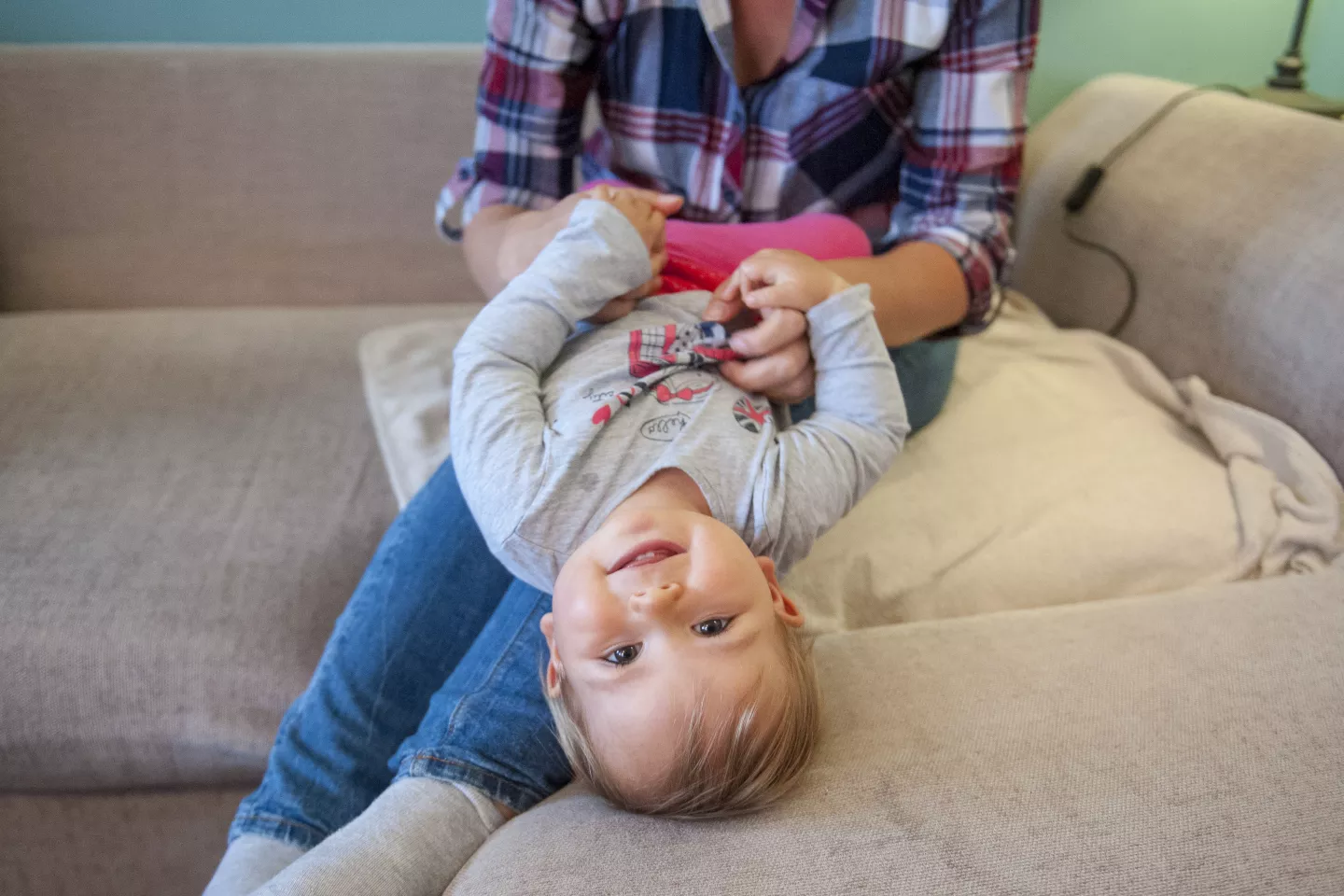 A mother and daughter play together