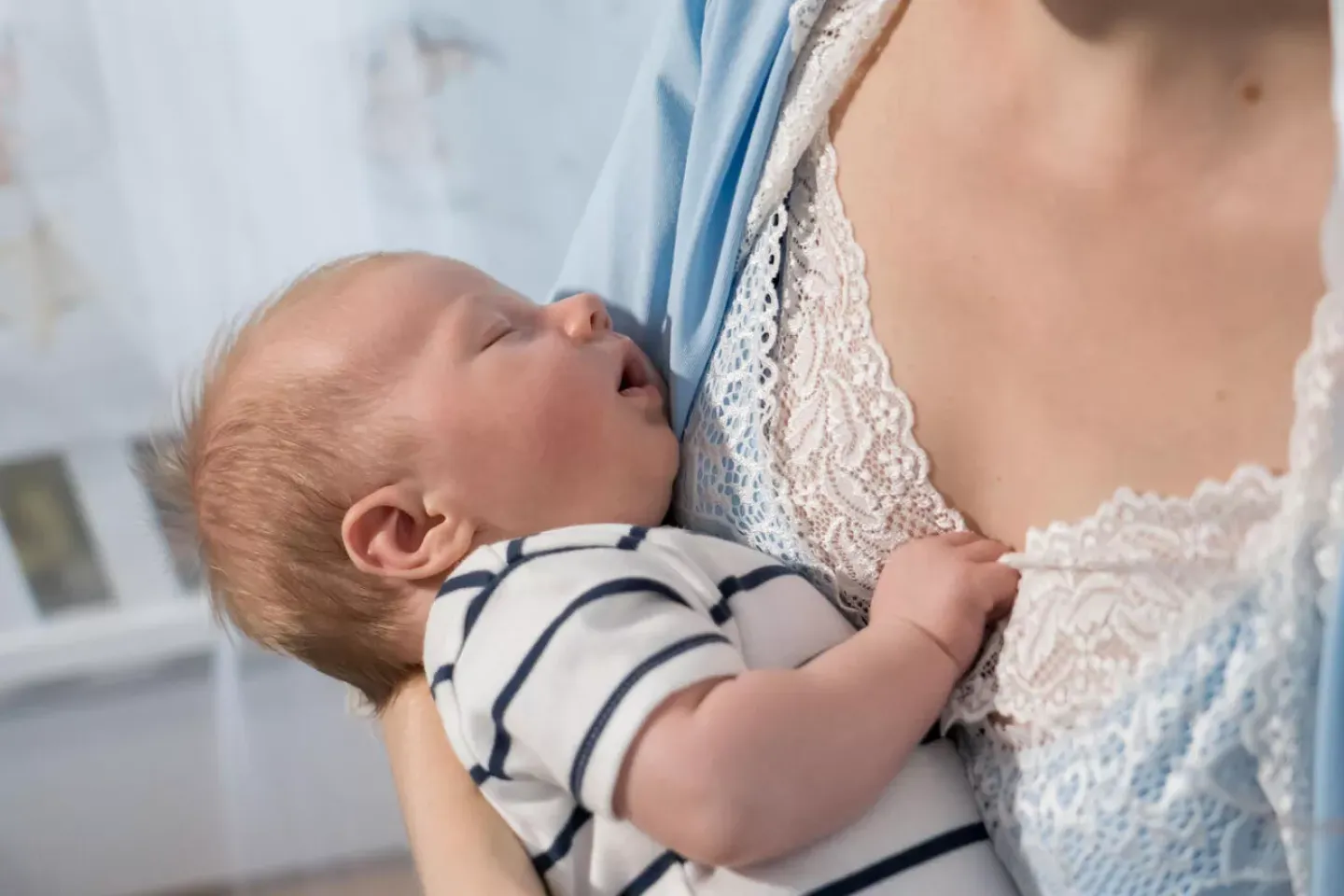 In Kyiv, Ukraine, 1-month-old Svyatoslav is sleeping on his mother's hands.