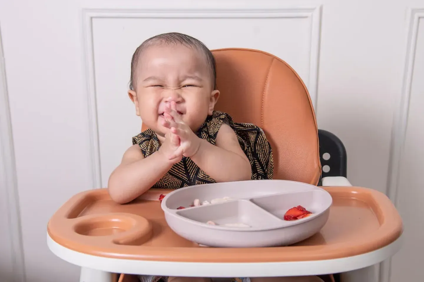 11-month-old baby eating pumpkin cereal at home in Desa Petaling, Kuala Lumpur.
