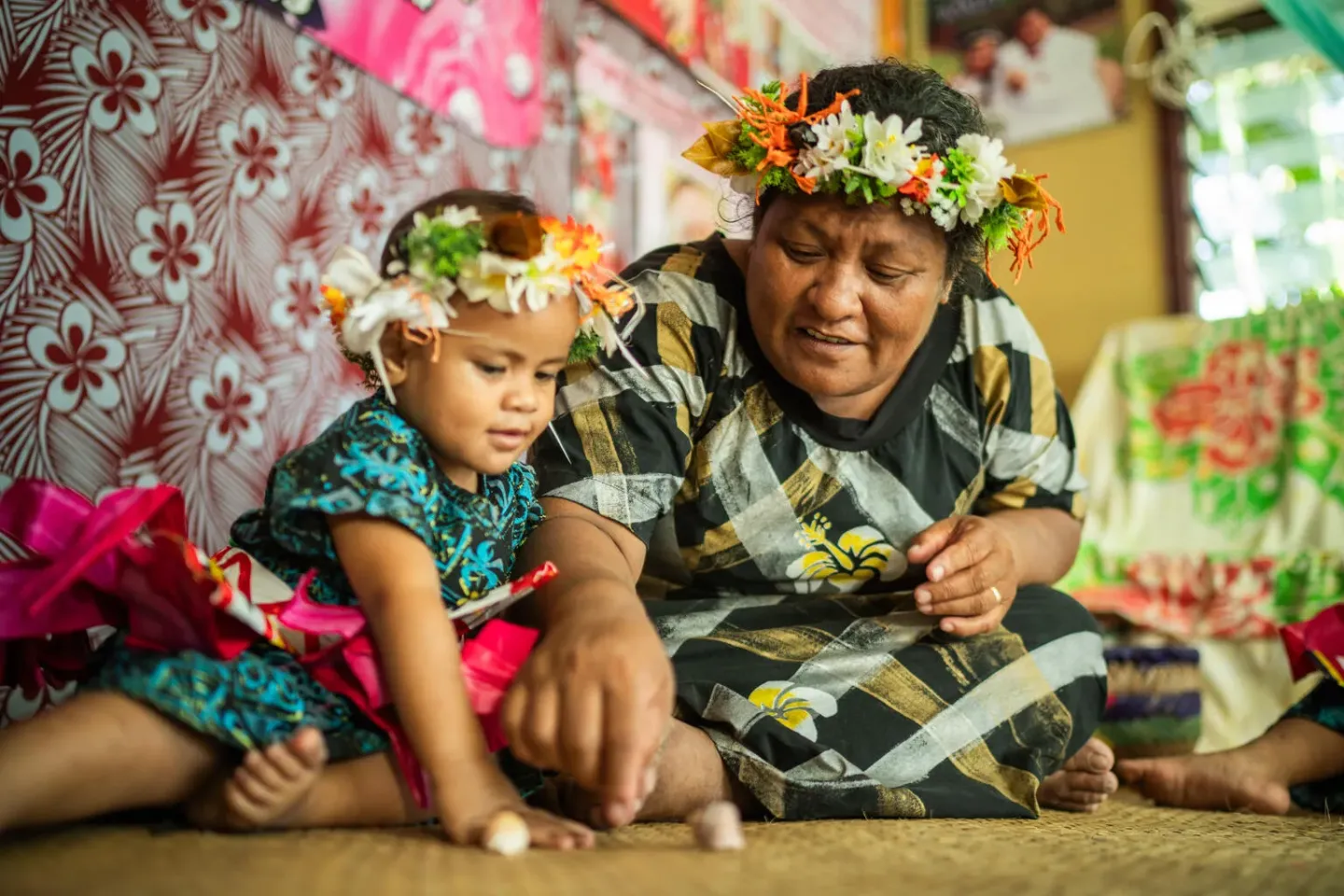 Milema Kisona plays with her 2-year-old daughter Victoria in their home in Funafuti, Tuvalu.