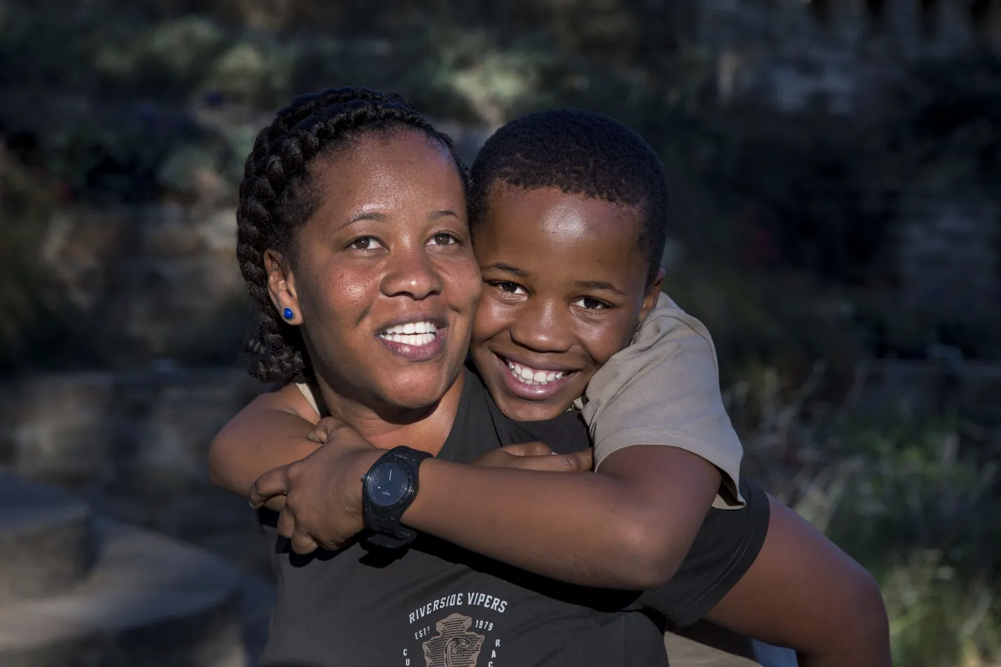 Mental health: a teen and his mother embrace
