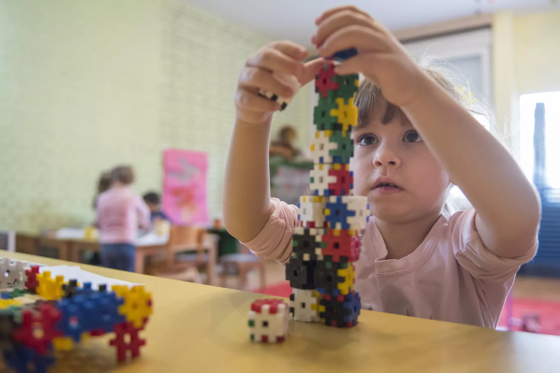 A girl plays with toys in an inclusive kindergarten Maslacak in Belgrade, Serbia.