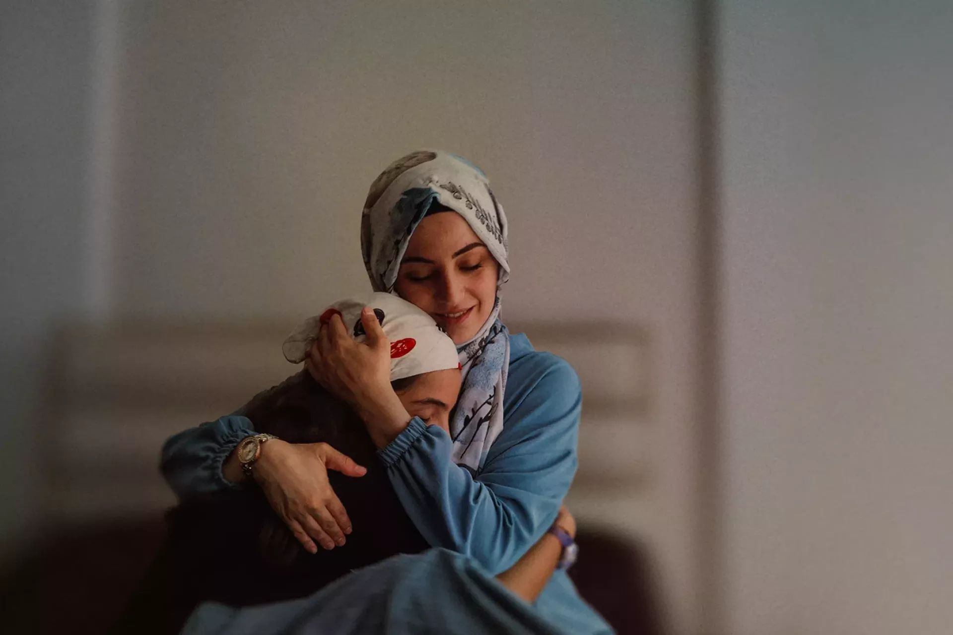 Raising Parents: A mother holds her daughter