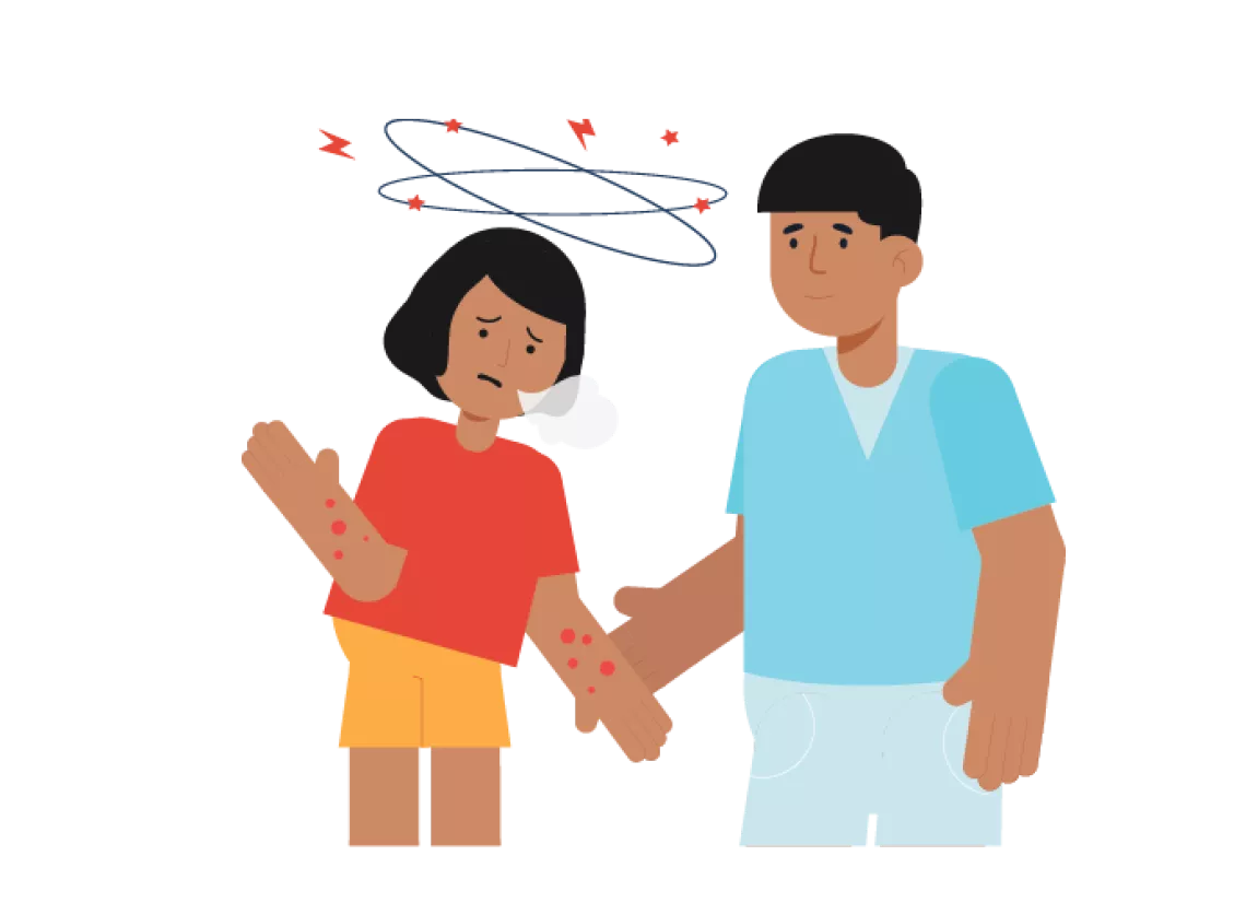 How to recognize symptoms of heatstroke: A girl looks confused as a caregiver supports her