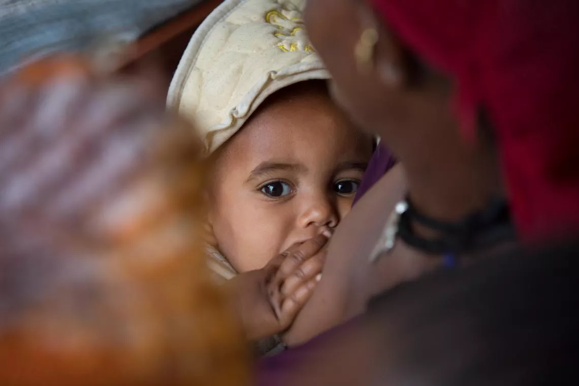 A baby is breastfed in Ethiopia.