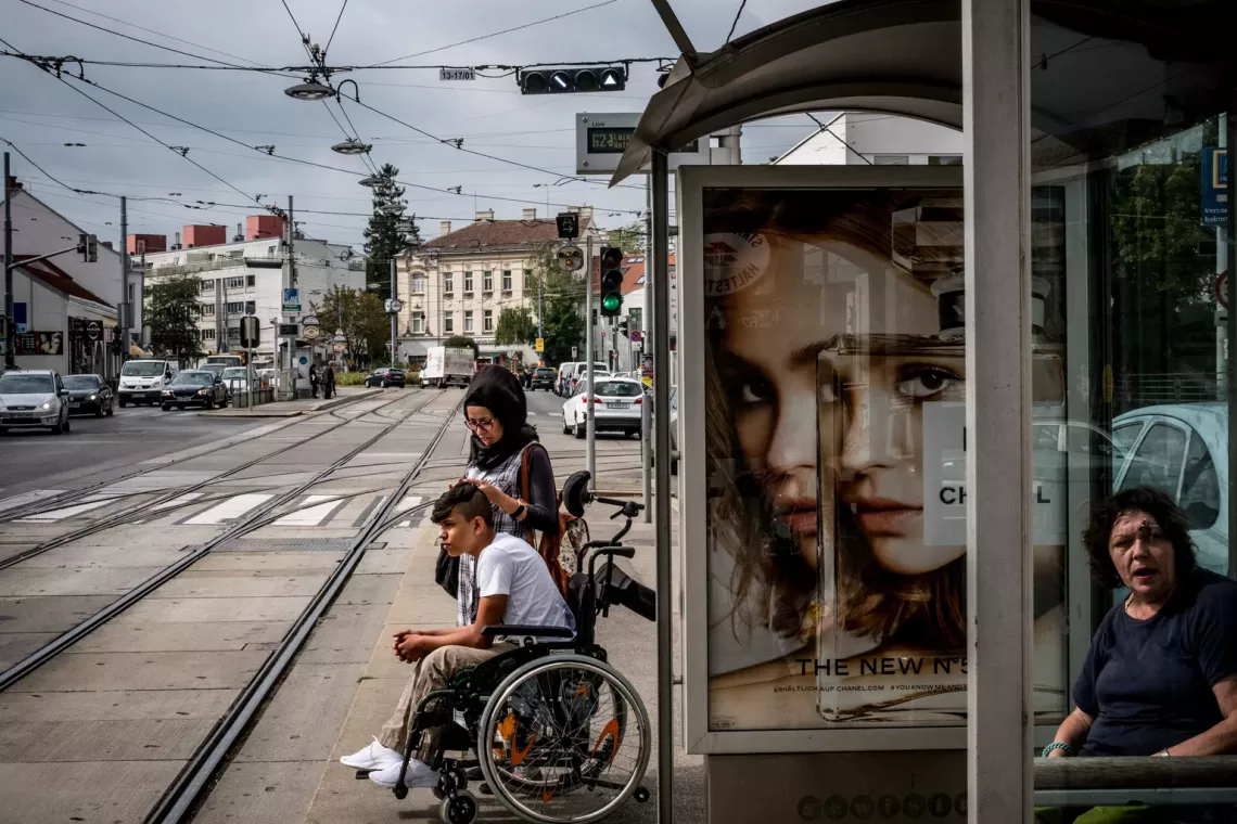 Houda Al-Malik, 26, and her brother Sajad Al-Faraji, 16, leave school in Vienna's 13th district, in Austria.