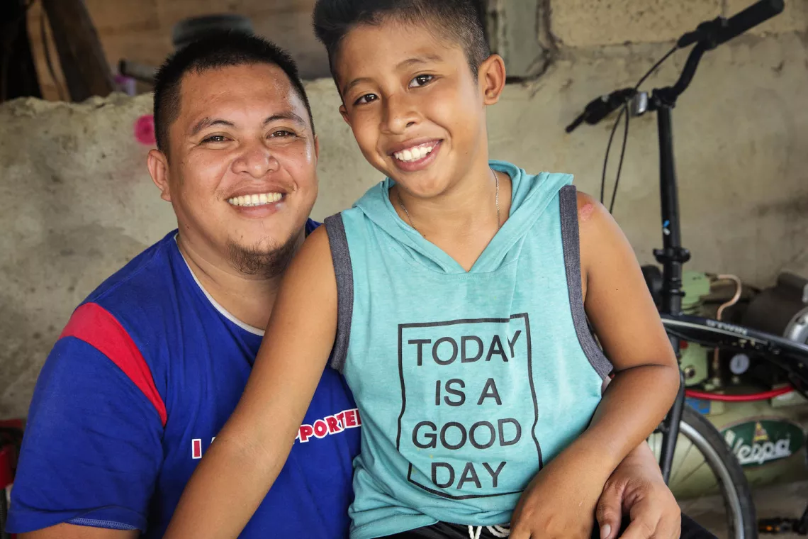 George Togane Jr. poses with his son Chansel Geo Togane in the Philippines. 