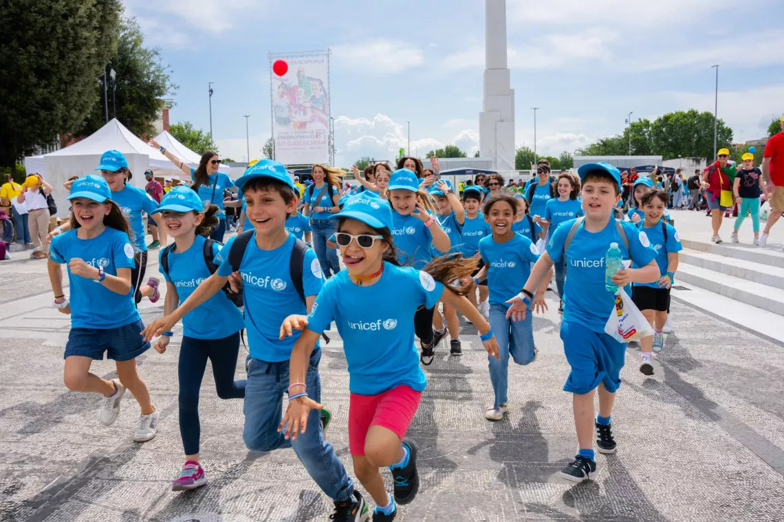 Children come together for an event to support child rights
