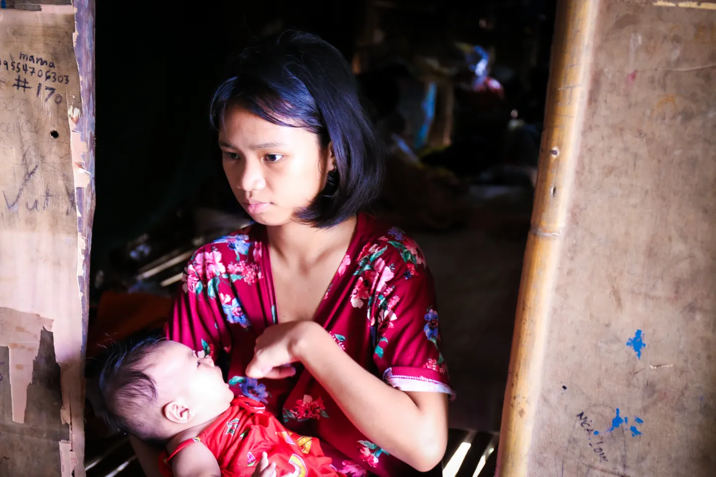 A young mother breastfeeds her baby