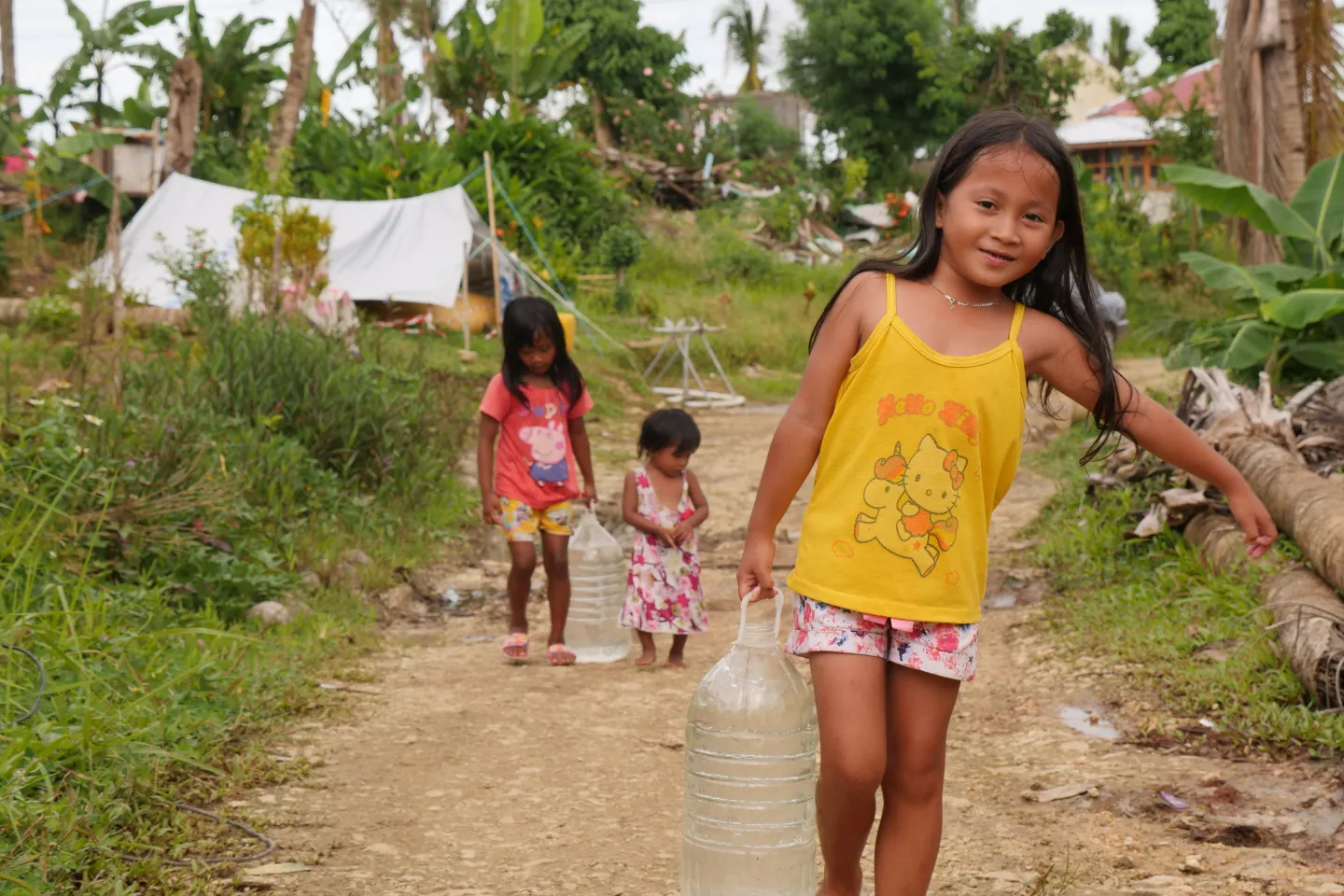 Children carrying safe water in Siargao