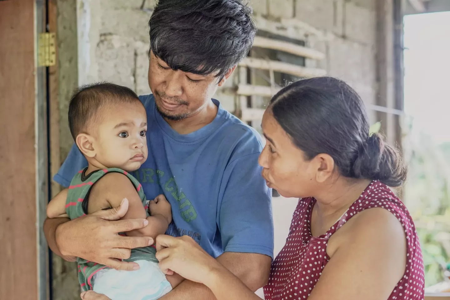 A family in front of their home 