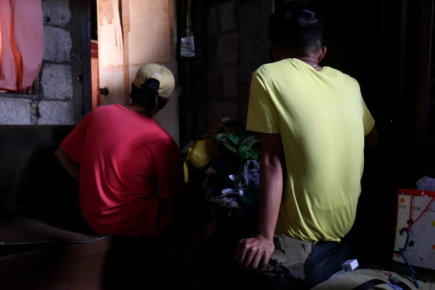 Two boys facing away from the camera