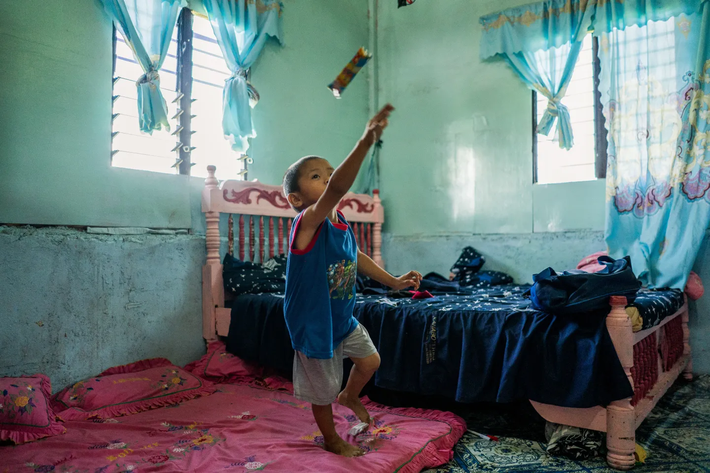 A child playing inside a bedroom
