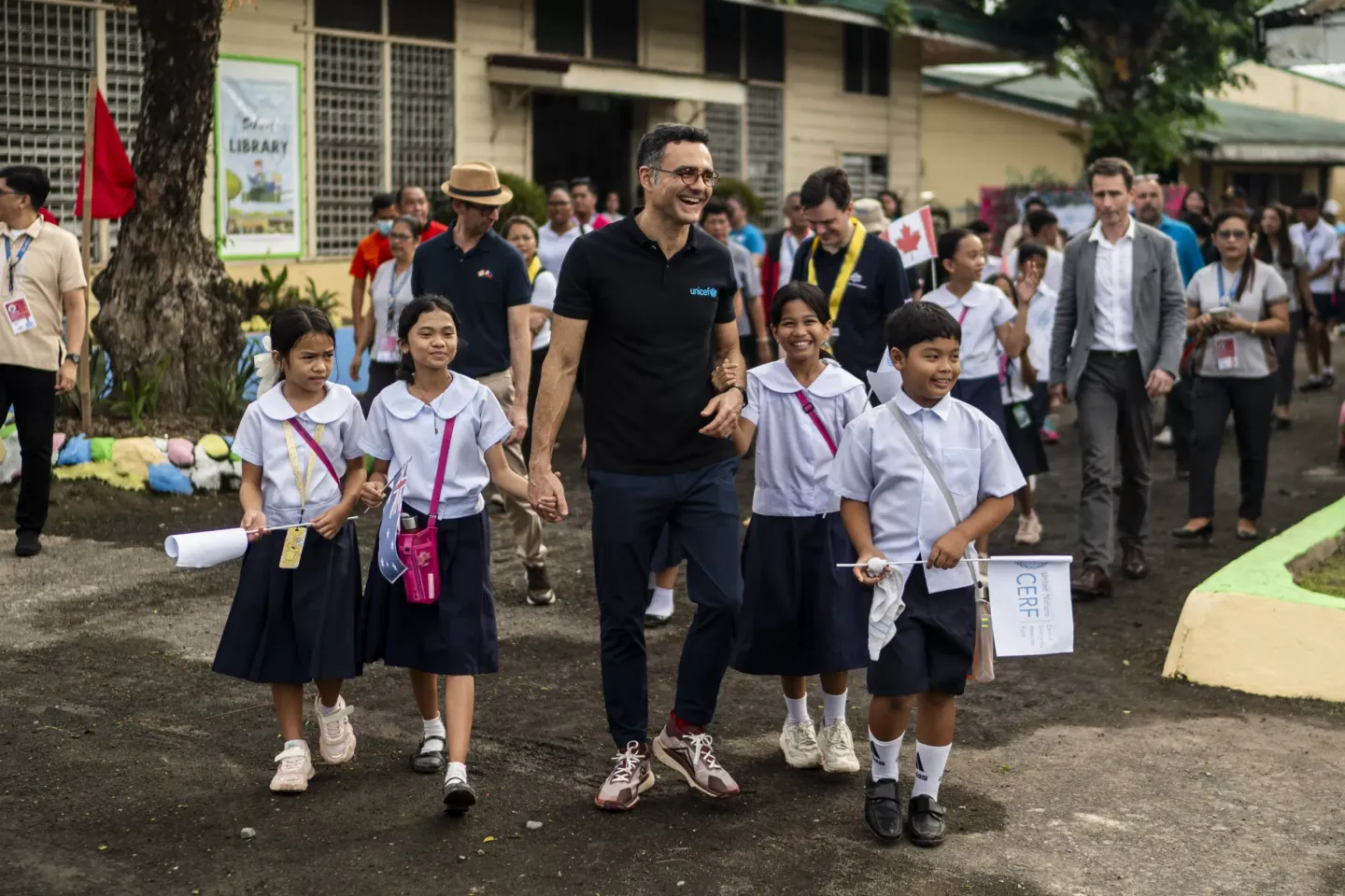Behzad with schoolchildren