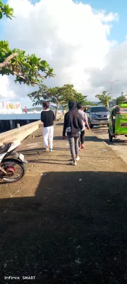 People walking along a sidewalk