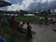 Workers tending to the ground