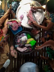 Overhead shot of household members doing laundry
