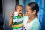 Mother and child holding RUTF