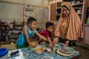 Norsainah at home with two of her sons, Saimen, 7, and Saiben, 6.