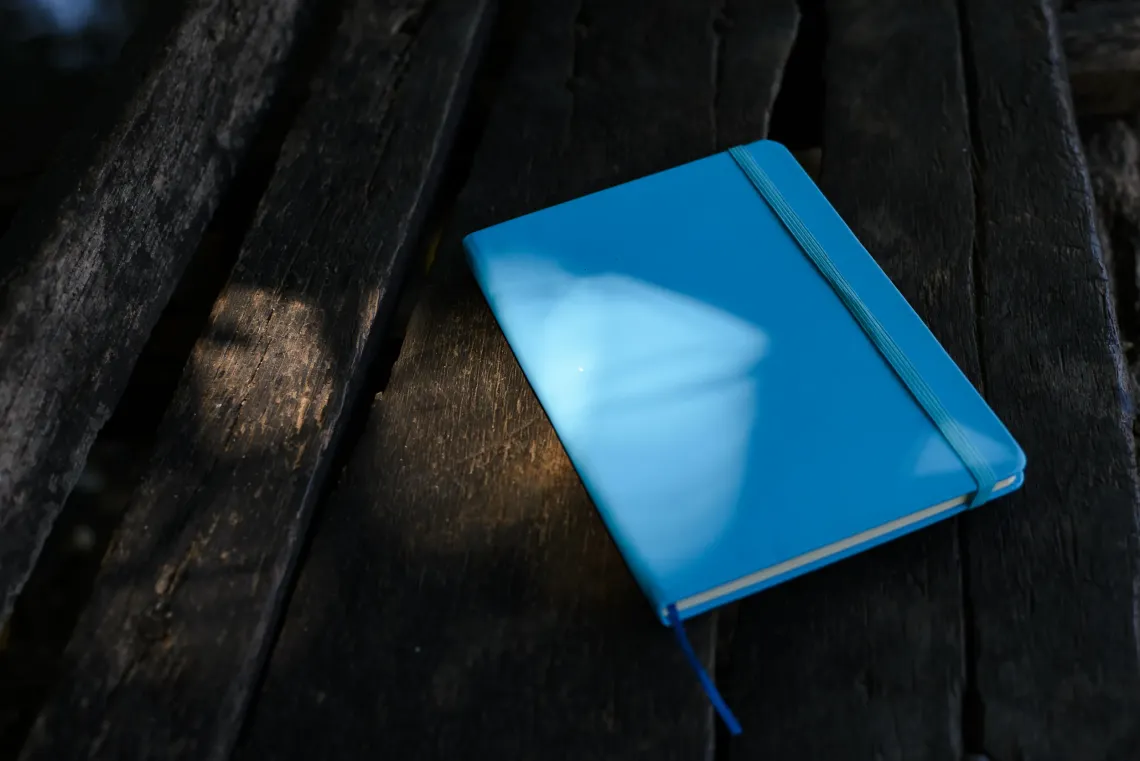 A cyan blue notebook carries children&rsquo;s messages across communities in the Bangsamoro