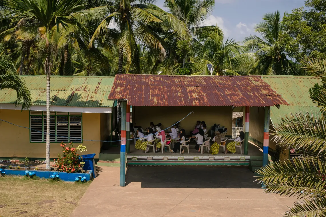 Students in Basila using the stage as a classroom