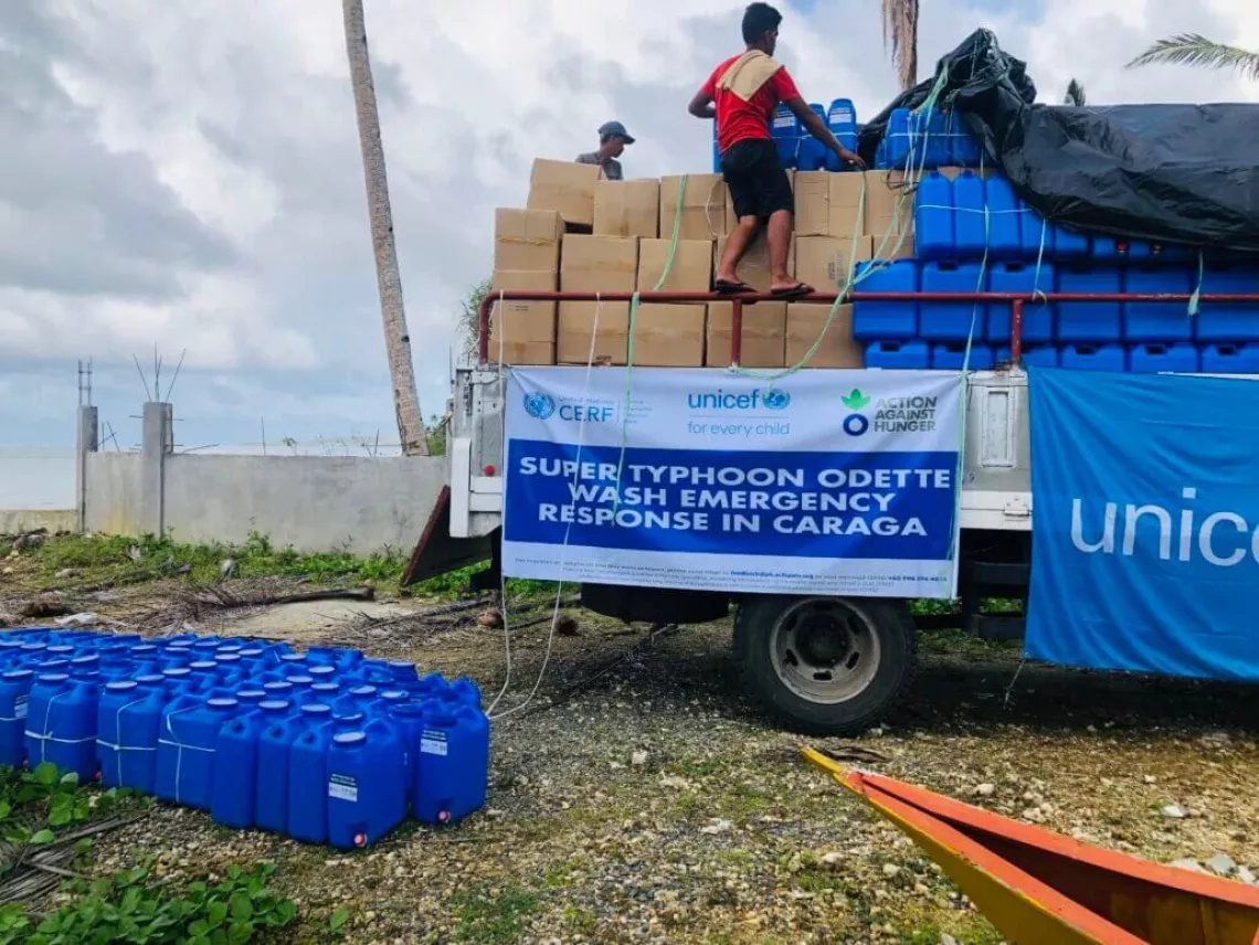 UNICEF Emergency WASH kits are unloaded for distribution in Barangay San Juan, San Benito in Siargao.